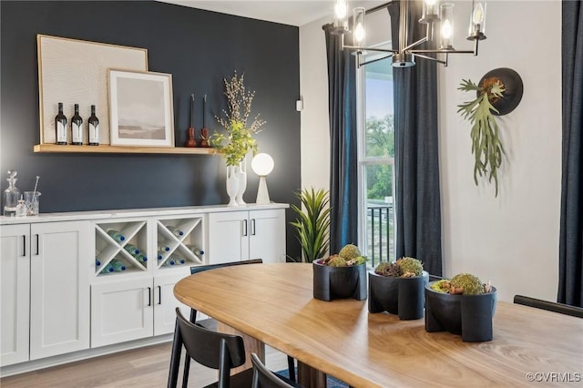 15319 Sunray Way, Chesterfield, VA 23832 - dining space featuring a chandelier, a dry bar, and light wood-style flooring