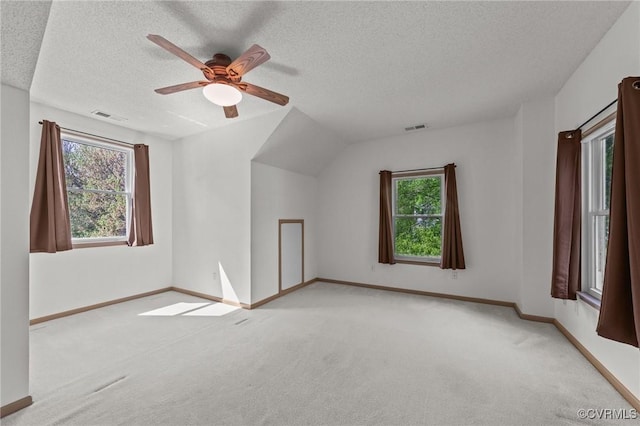 bonus room featuring baseboards, a ceiling fan, visible vents, and carpet floors