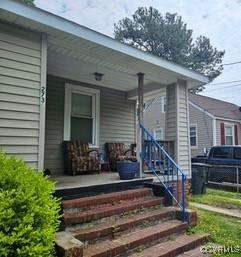 view of exterior entry featuring a porch