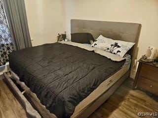 bedroom featuring wood finished floors
