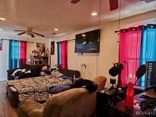 bedroom with recessed lighting and wood finished floors