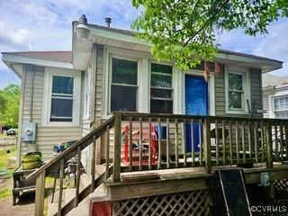 rear view of house with a deck