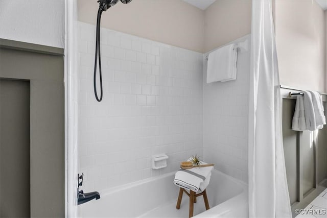 bathroom featuring shower / tub combo with curtain