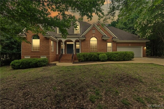 132 Warwick Hls, Williamsburg, VA 23188 - view of front of property featuring brick siding, a lawn, a garage, and concrete driveway