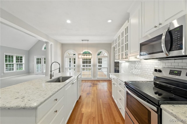 132 Warwick Hls, Williamsburg, VA 23188 - kitchen with stainless steel appliances, white cabinets, tasteful backsplash, glass insert cabinets, and recessed lighting