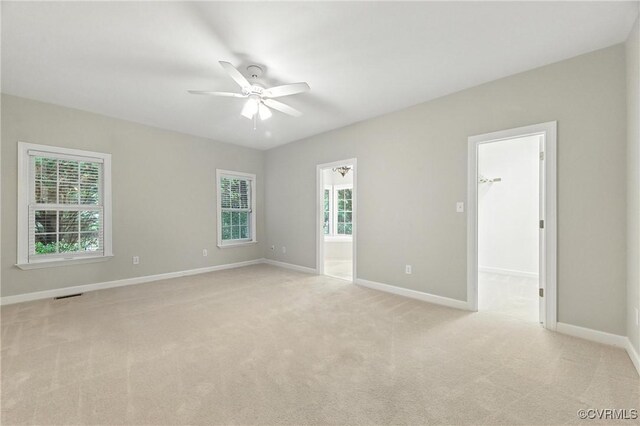 132 Warwick Hls, Williamsburg, VA 23188 - empty room with a ceiling fan, plenty of natural light, and light carpet