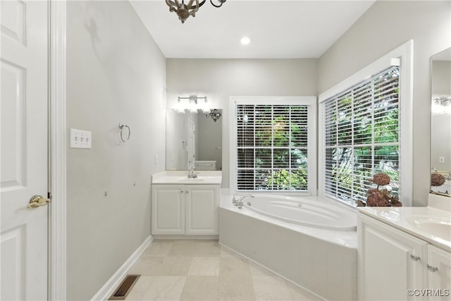 132 Warwick Hls, Williamsburg, VA 23188 - bathroom featuring a bath, two vanities, and tile patterned flooring