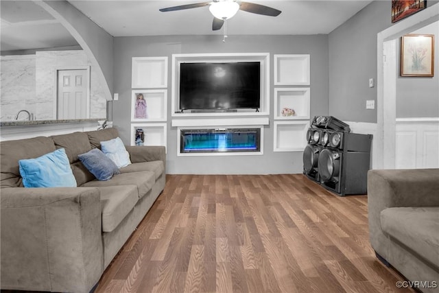 32390 S Main St, Boykins, VA 23827 - living room featuring a ceiling fan, wood finished floors, and arched walkways