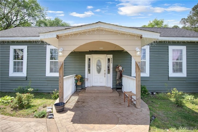 32390 S Main St, Boykins, VA 23827 - property entrance featuring a shingled roof and covered porch