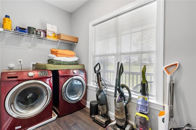 washroom featuring independent washer and dryer, wood finished floors, baseboards, and laundry area