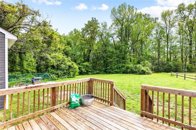 deck featuring a yard and fence