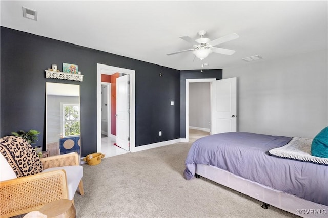 bedroom featuring baseboards, a ceiling fan, visible vents, and carpet floors