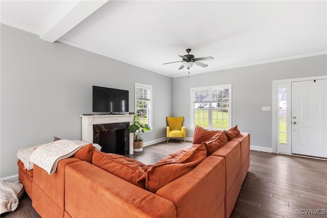 living room featuring baseboards, a ceiling fan, and dark wood-type flooring