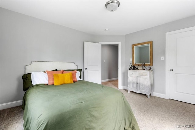 bedroom featuring carpet floors and baseboards