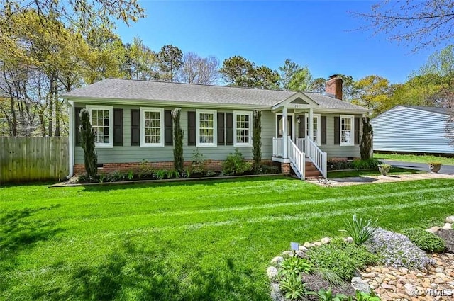 single story home with a front yard, crawl space, a chimney, and fence