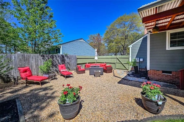 view of yard featuring outdoor lounge area, a patio, and a fenced backyard