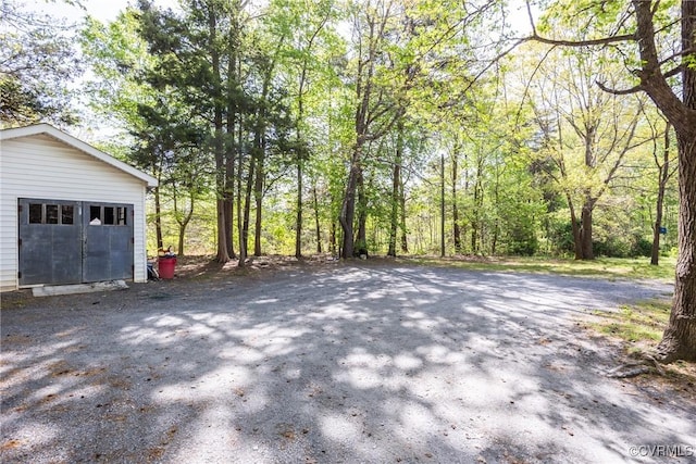 exterior space featuring a forest view