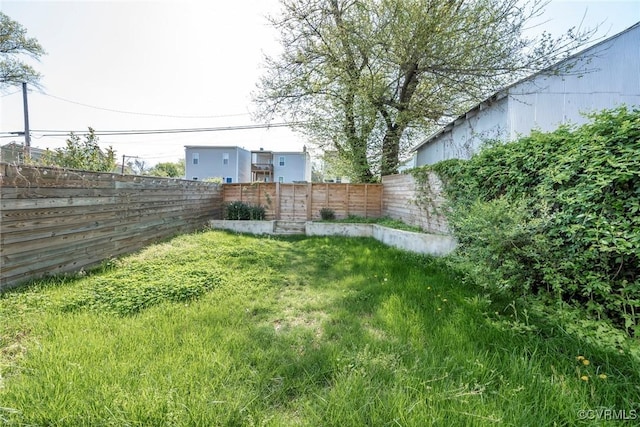 view of yard with a fenced backyard