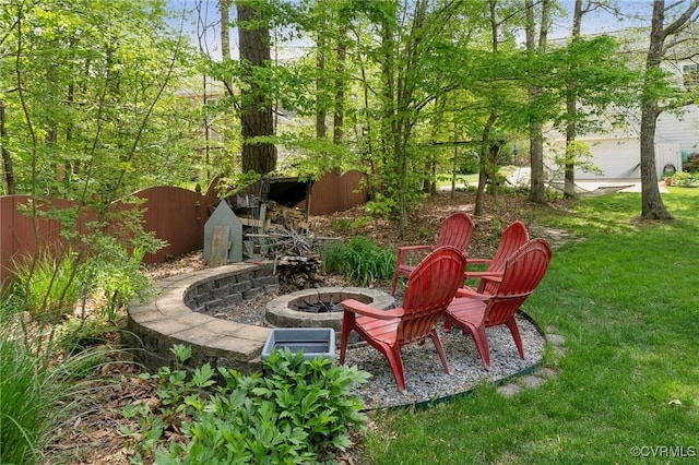 view of yard with a fire pit
