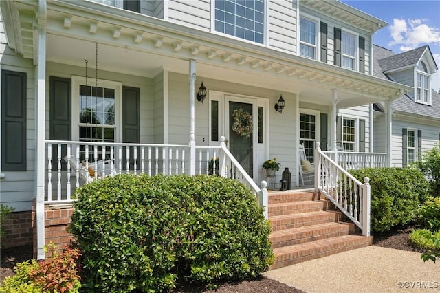 doorway to property featuring covered porch