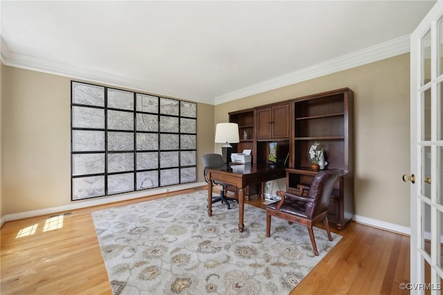 office area with baseboards, ornamental molding, and wood finished floors