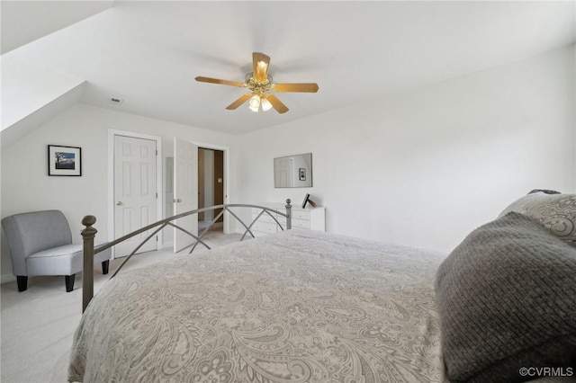 bedroom with a ceiling fan and carpet