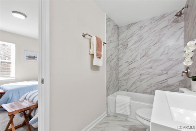 bathroom featuring baseboards, ensuite bathroom, toilet, bathtub / shower combination, and marble finish floor