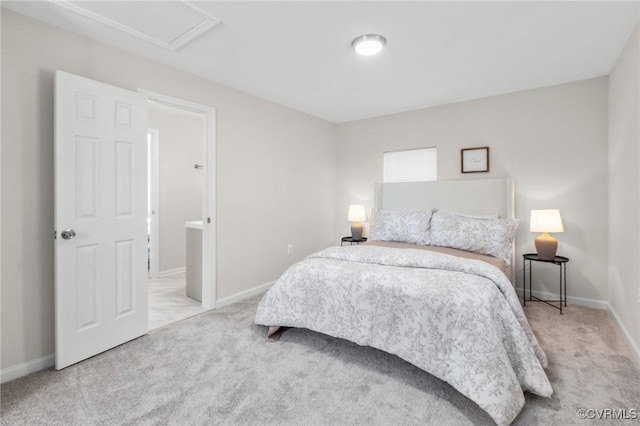 bedroom featuring light colored carpet and baseboards