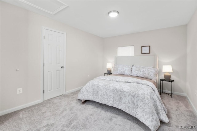 carpeted bedroom with baseboards