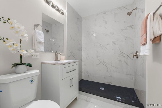 full bathroom featuring toilet, vanity, marble finish floor, and a marble finish shower
