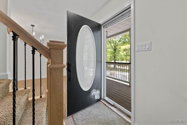 doorway to outside featuring stairs
