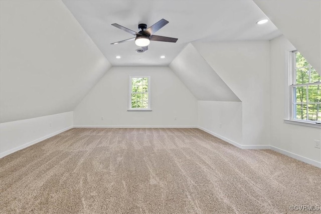 additional living space with ceiling fan, carpet, recessed lighting, baseboards, and lofted ceiling