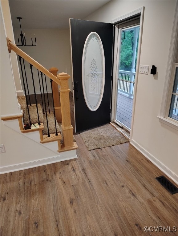 6013 Linden Ln, Disputanta, VA 23842 - foyer with wood finished floors, baseboards, and stairway