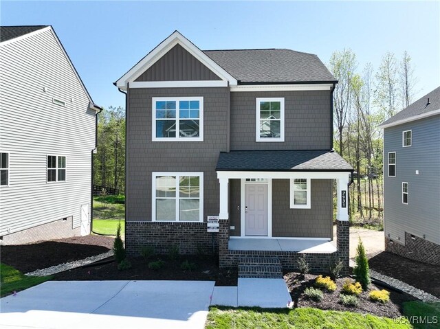 7931 Lyndale Dr, Chesterfield, VA 23235 - view of front of home with covered porch, a shingled roof, and board and batten siding