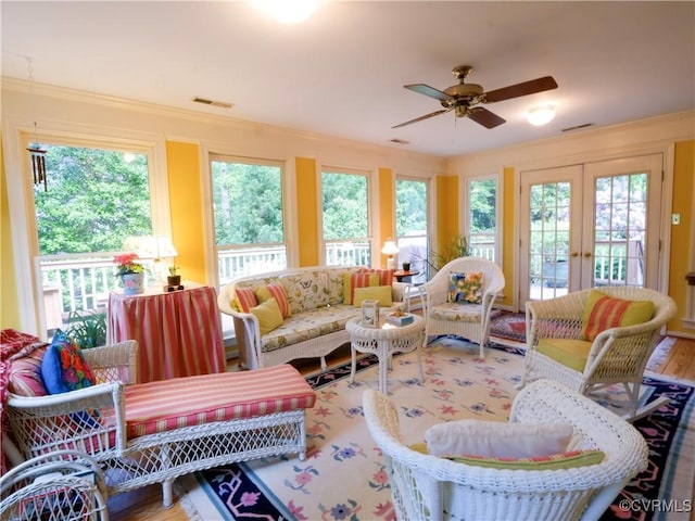 sunroom featuring visible vents and french doors