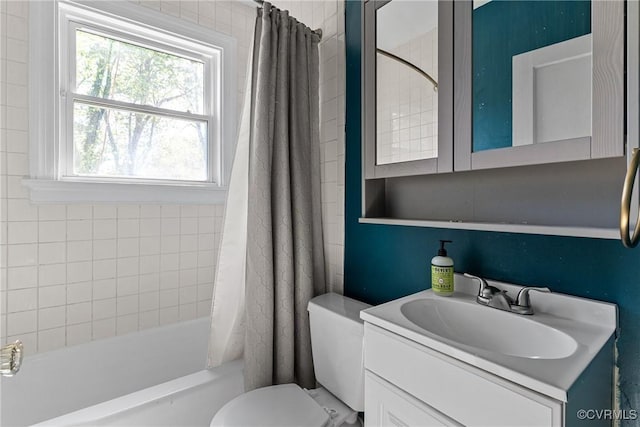 full bathroom featuring shower / bath combo with shower curtain, vanity, and toilet