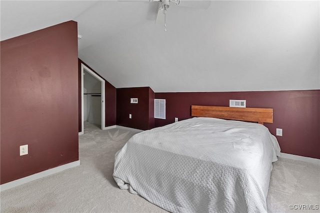 bedroom featuring visible vents, baseboards, carpet, and vaulted ceiling