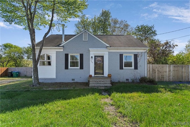 bungalow with crawl space, fence, a front lawn, and brick siding
