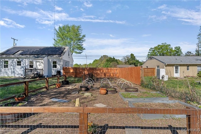 view of yard featuring a garden and fence private yard
