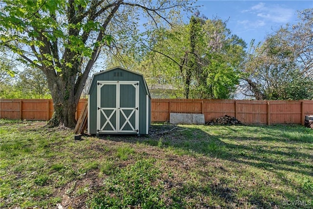 view of shed with a fenced backyard