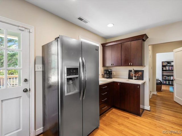 1612 Brookland Pkwy, Richmond, VA 23227 - kitchen featuring stainless steel refrigerator with ice dispenser, dark brown cabinets, light countertops, light wood-type flooring, and recessed lighting
