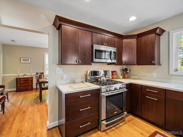 1612 Brookland Pkwy, Richmond, VA 23227 - kitchen featuring stainless steel appliances, light countertops, light wood finished floors, dark brown cabinets, and recessed lighting