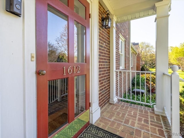 1612 Brookland Pkwy, Richmond, VA 23227 - view of exterior entry featuring a porch and brick siding