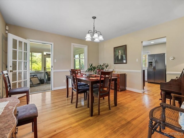 1612 Brookland Pkwy, Richmond, VA 23227 - dining space with a chandelier, light wood-type flooring, and baseboards