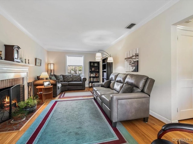 1612 Brookland Pkwy, Richmond, VA 23227 - living area featuring wood finished floors, ornamental molding, a fireplace, and baseboards