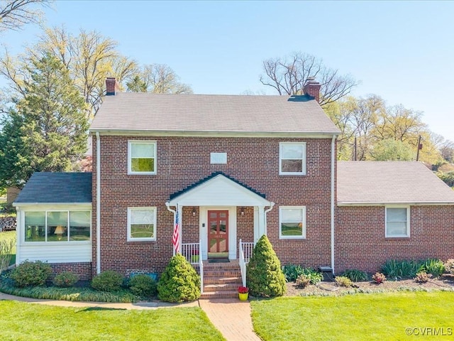 1612 Brookland Pkwy, Richmond, VA 23227 - view of front of home featuring a chimney and brick siding