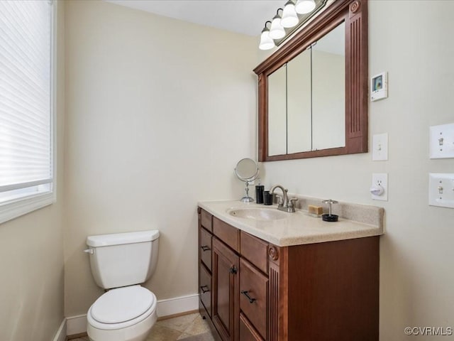 1612 Brookland Pkwy, Richmond, VA 23227 - half bathroom featuring baseboards, vanity, and toilet