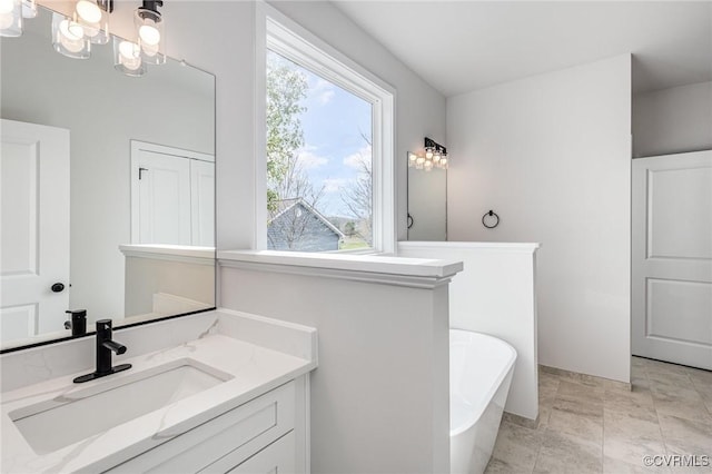 26437 Pennfields Dr, Orange, VA 22960 - bathroom with a freestanding tub, a chandelier, and vanity