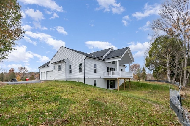 26437 Pennfields Dr, Orange, VA 22960 - view of side of home with a yard, an attached garage, asphalt driveway, and a wooden deck