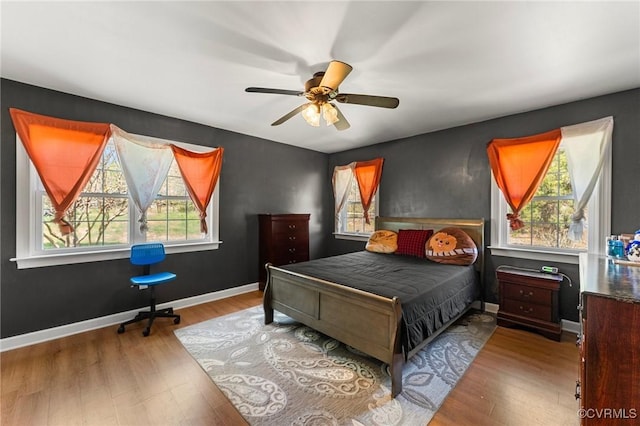 1474 Welsh Tract Rd, Charlotte Courthouse, VA 23923 - bedroom with multiple windows, wood finished floors, and ceiling fan